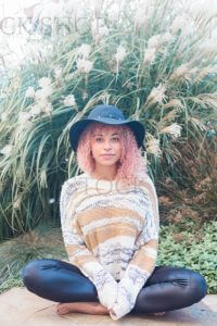 picture of a woman sitting on the ground with her legs crossed thinking about how to check for hormone imbalance, hormone testing for hormone imbalance