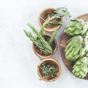 Add the Power of Herbs: Natural Healing for Vibrant Living picture of herbs like sage, rosemary, thyme, and artichoke that can be used for natural herbal treatment