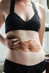 picture of a woman with her hand over her liver