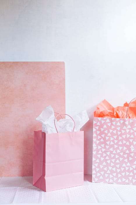 Naturopath Gift Cards picture of pink gift bags that hold naturopathic doctor gift cards or gift certificates