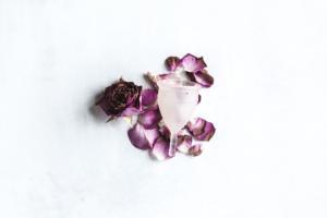 Missed Periods: A Naturopathic Approach to Amenorrhea picture of flowers with a menstrual cup that isn't being used because of missed periods
