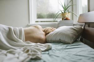 Sleep Apnea in Women: The Underdiagnosed Hormone Connection picture of a woman with undiagnosed sleep apnea related to menopause, PCOS and hypothyroidism